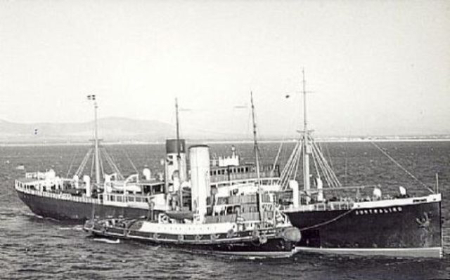 Australind with harbour tug alongside